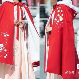 Red embroidered cape with faux fur lining